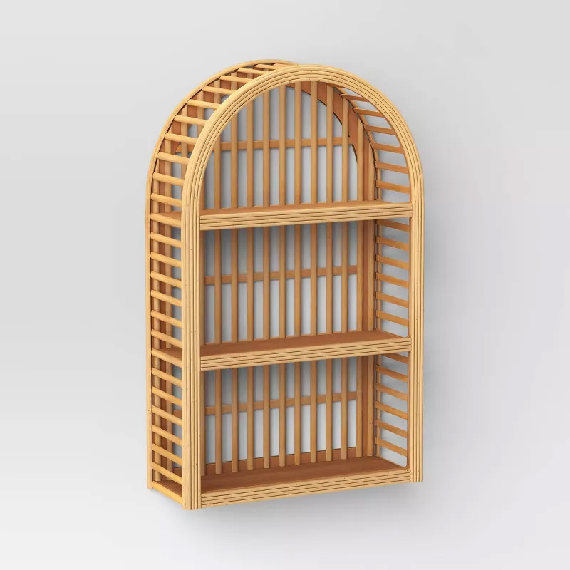 A wood and rattan shelf to be hung on the wall