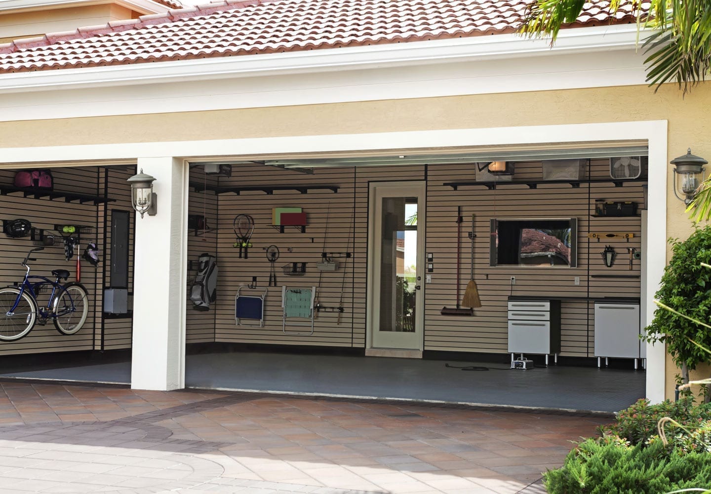 A neatly organized garage with walls optimized for storage