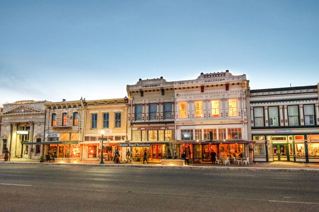 Facade of illuminated buildings at duck in downtown Georgetown