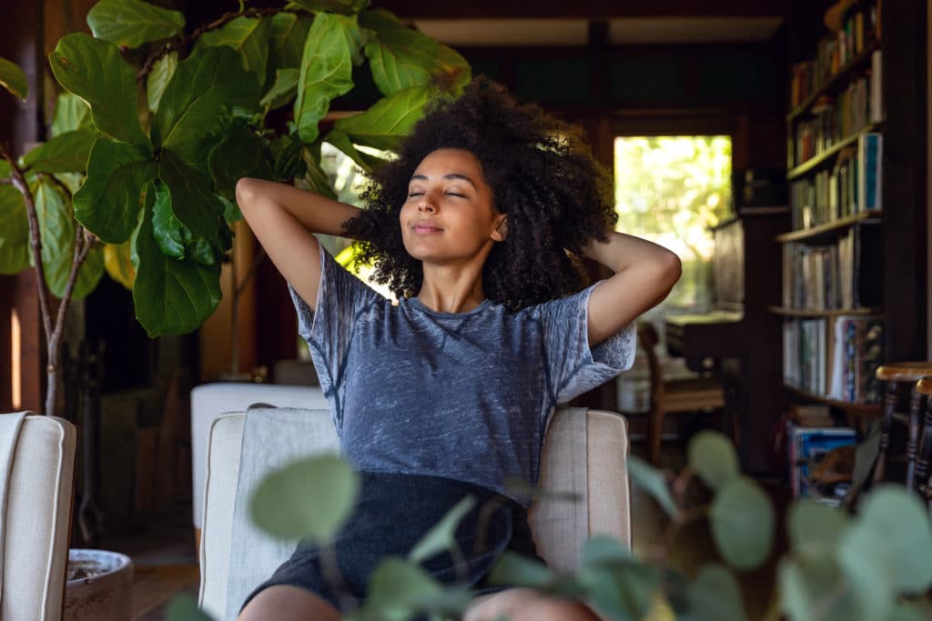 Young woman leaning back in chair in Los Angeles office