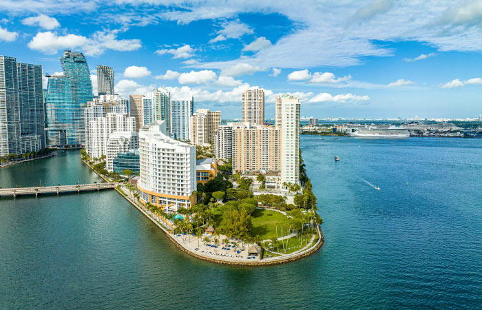Aerial view of Brickell Key in Brickell — one of the safest neighborhoods in Miami — on a sunny day.