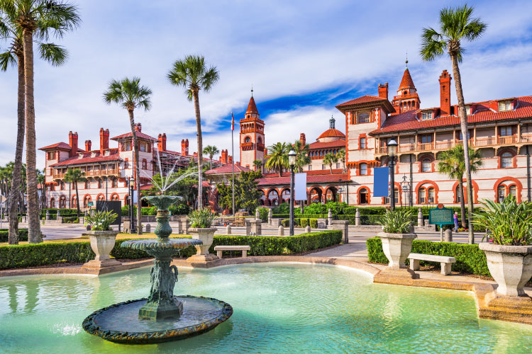 The buildings in downtown St. Augustine, Florida, have a Spanish flair to them, featuring light exteriors and vibrant red tile roofs.