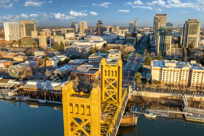 Aerial view of Tower Bridge and nearby Downtown — one of the best neighborhoods in Sacramento, California.