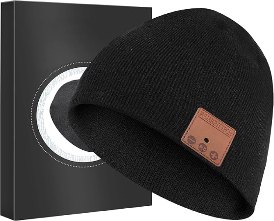 A black knit beanie hat with a small square leather patch with control buttons for the built-in bluetooth speaker — one of the cooler white elephant gift ideas this year.