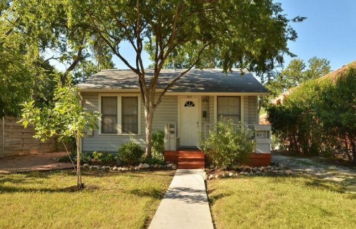 A cute one-story residential home in the Hyde Park neighborhood of Austin, Texas.