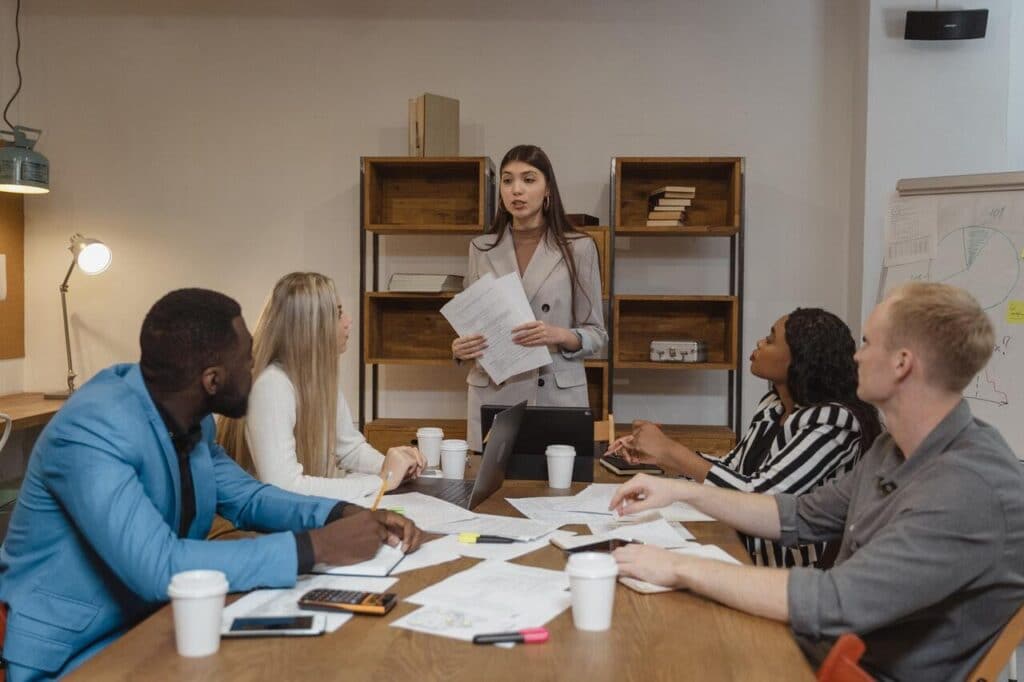 Five people having a strategic team meeting.