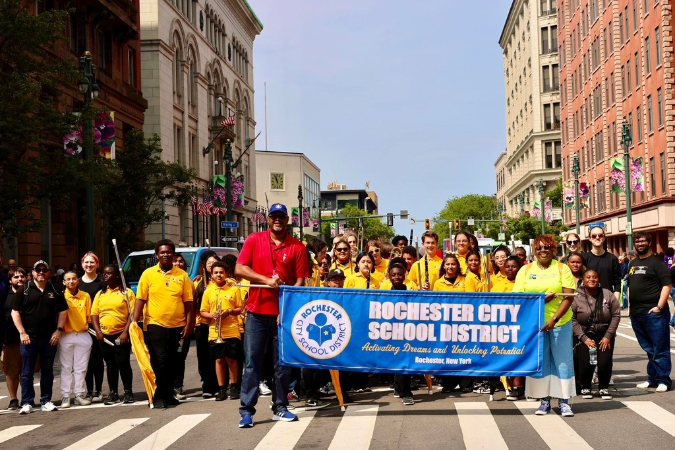 Superintendent, teachers, and students from Rochester City School District gather for a Juneteenth parade in New York, a state often ranked among the best states for teachers.