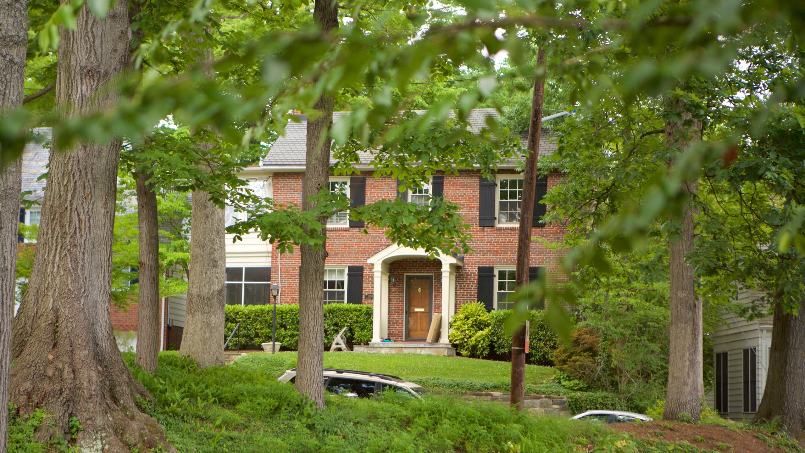 A two-story brick home in Washington D.C.’s Barnaby Woods neighborhood