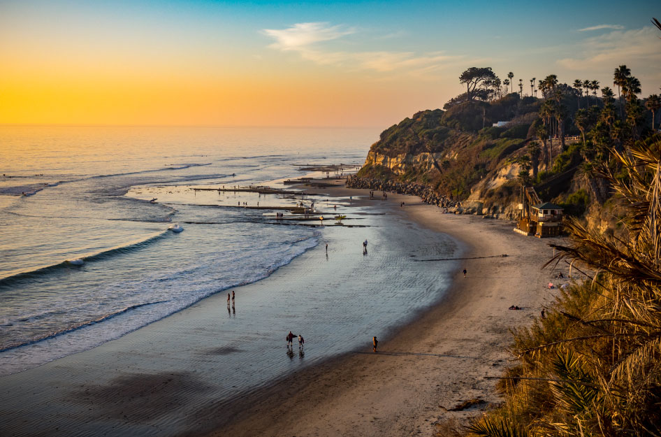 Locals enjoy the sunset at Swami’s Beach in Encinitas, California — one of the best cities near San Diego