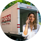 A PODS customer on a phone call in front of their open container