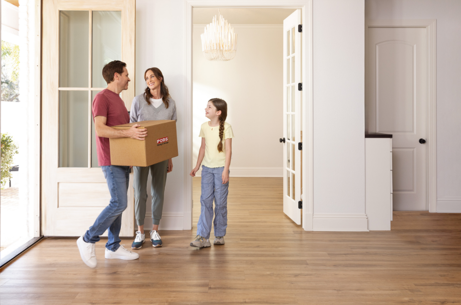 A young family of three smiles in their new home that they found in one of the best cities in Texas to raise a family.