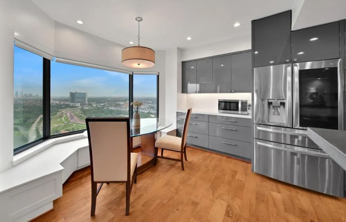 The interior of a high-rise condo, showcasing an amazing view of Houston’s Medical Center Area — one of the best neighborhoods Houston has to offer.