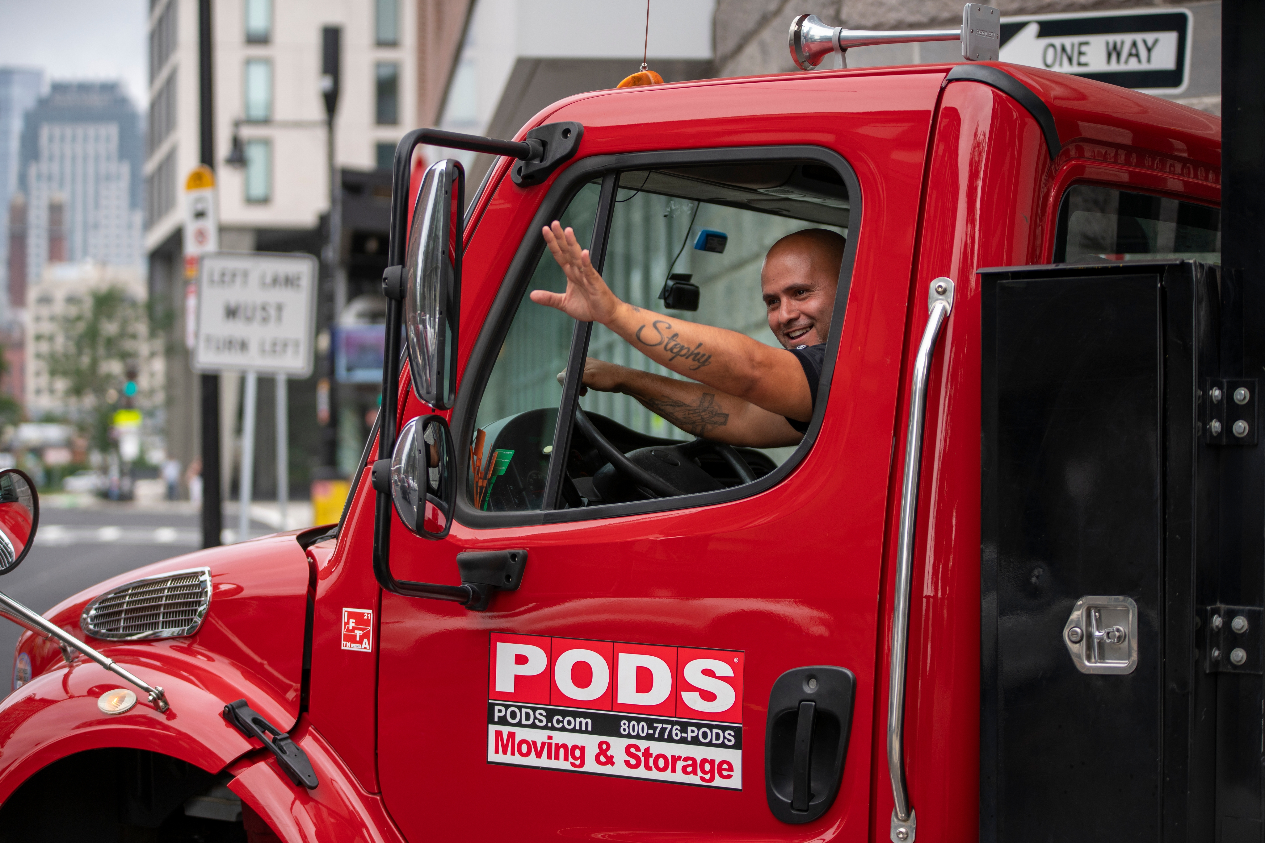 Truck waving in a city