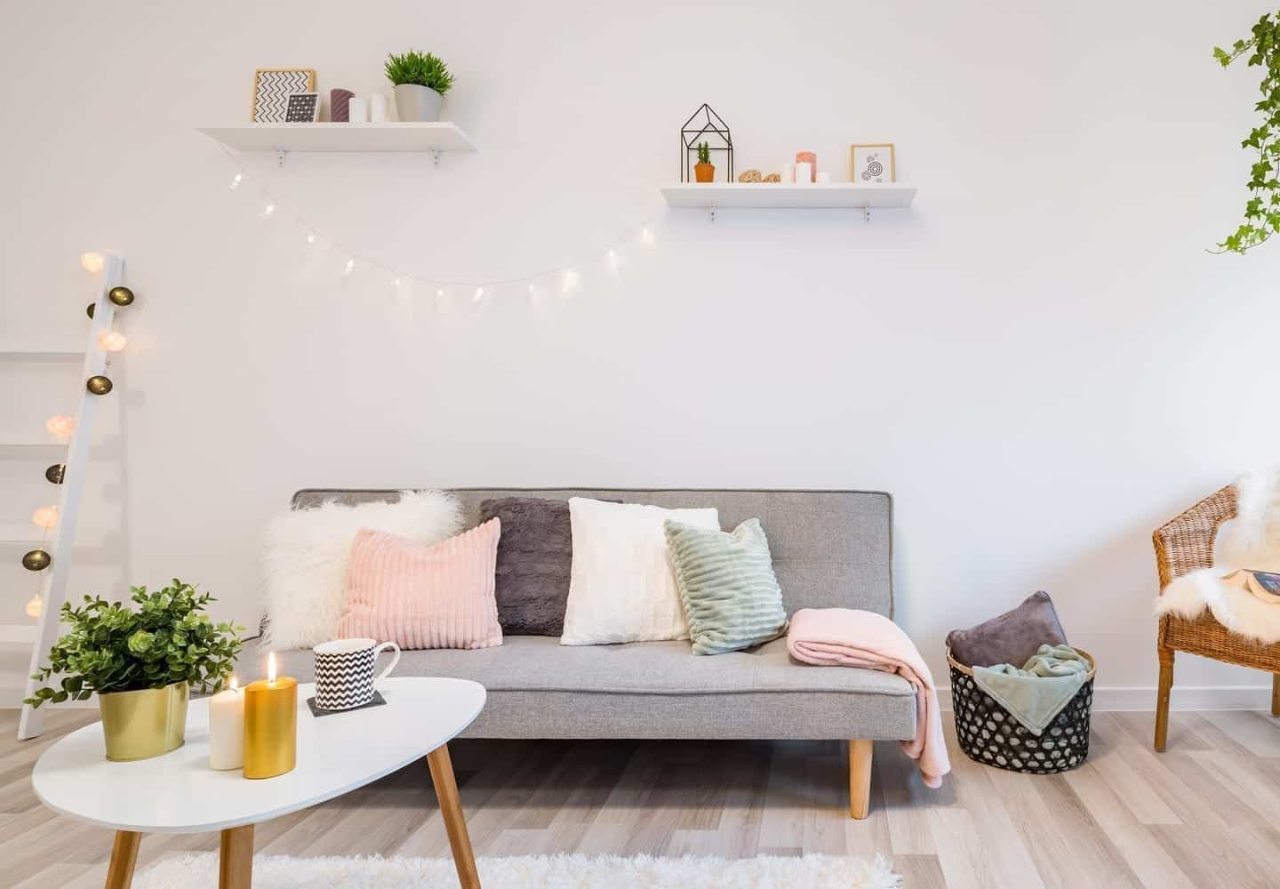 A minimally decorated room with high shelves that draw the eye upward