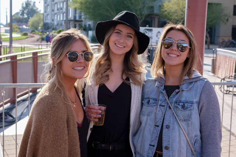 Three young women pose for a photo during an afternoon out in Scottsdale, Arizona.