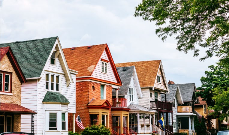 A row of two-story homes with gabled roofs in the popular Lower East Side neighborhood of Milwaukee. 