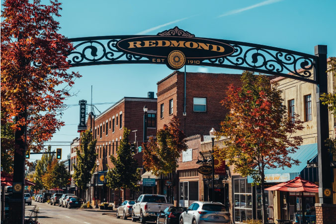 The entrance to downtown Redmond, Oregon, is decorated with an ornate town sign that reads, “REDMOND EST 1910.”