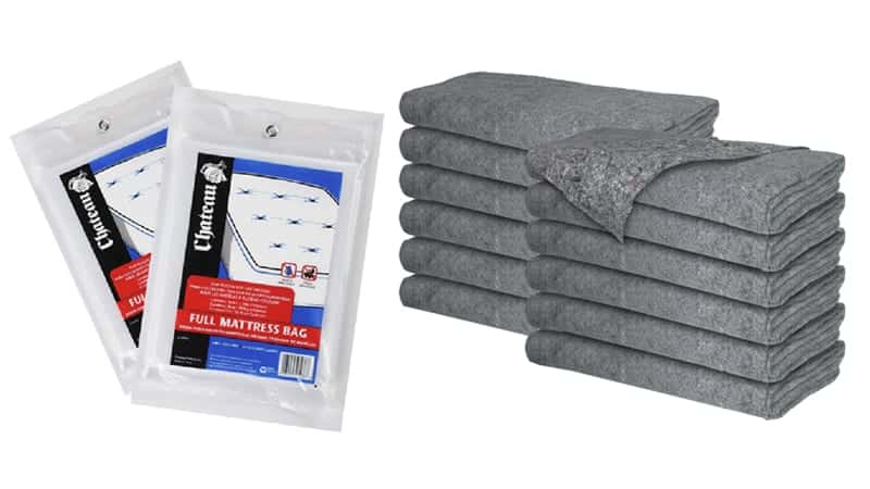 Two stacks of gray moving blankets and a pair of clear mattress bags.