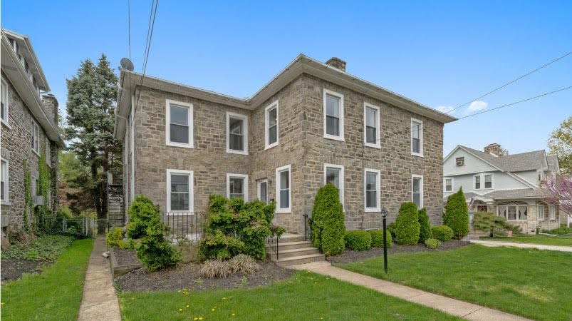 A boxy, stone-front, two-story home in Drexel Hill, Pennsylvania — one of the more affordable cities close to Philadelphia.