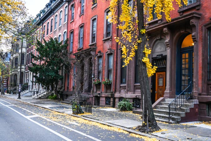View of brick townhomes in the Rittenhouse Square — a popular neighborhood for those moving to Philadelphia from NYC.