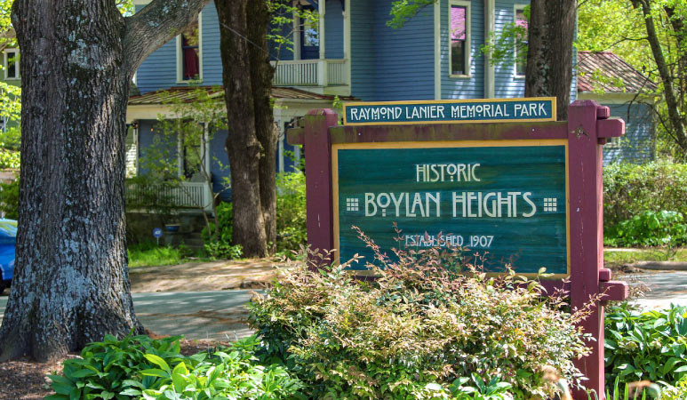 The green and red Raymond Lanier Memorial Park sign is shown.