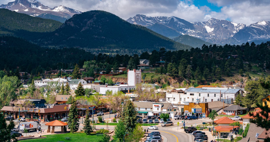 It’s a clear day at Estes Lake in Colorado. Between the lake and the mountains lies the community of Estes Park, Colorado.