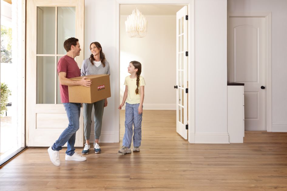 A young family moves into a new home. They are trying to figure out what new homeowner tasks they need to complete.