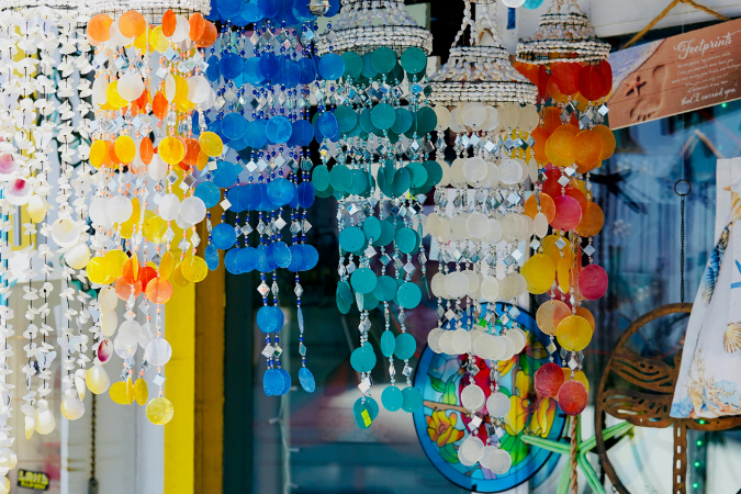 Homemade seashell decorations hang at an art festival in Delray Beach, FL.