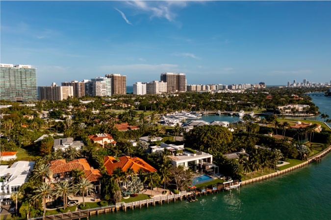A residential neighborhood in the Miami suburb of Bal Harbour, Florida, featuring luxury waterfront mansions and private docks. 