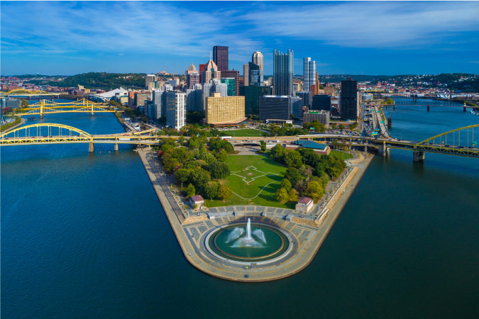 Aerial view of Downtown Pittsburgh, Pennsylvania, featuring Point State Park and the two rivers and bridges