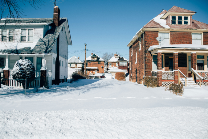 Two homes on a snowy day. Living in Detroit means having to bundle up.