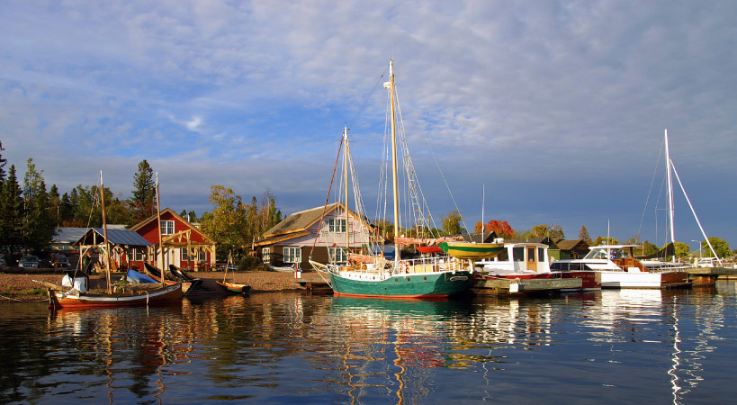 A scenic lakeside view of the harbor in Grand Marais, Minnesota.