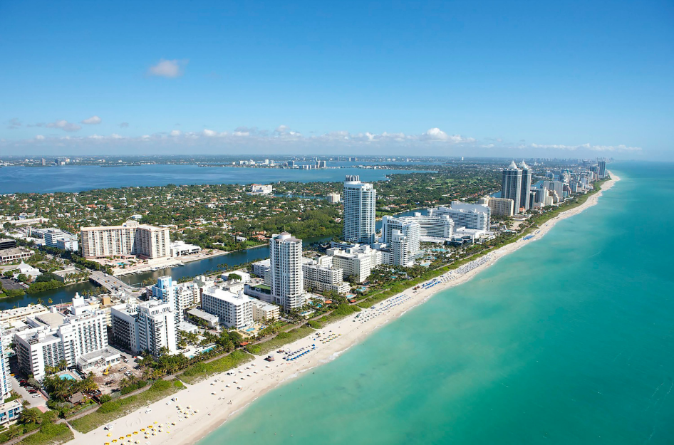 An aerial image of South Beach in Miami, FL. There are plenty of ways to experience the beach while living in Miami on a budget.