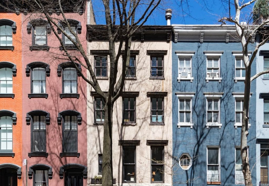 A row of colorful apartment buildings in the Williamsburg neighborhood of The Bronx — one of the boroughs of New York.