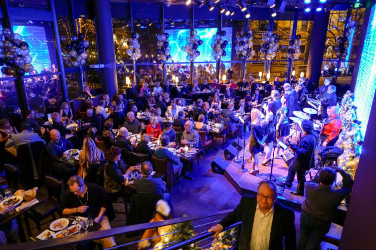 A live band plays to a packed house at Bake’s Place Bar & Bistro in Bellevue, Washington.