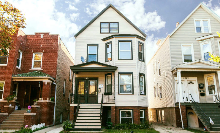 Exterior view of three distinct townhomes in Chicago’s Avondale neighborhood. 