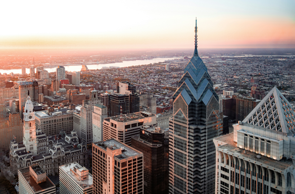 An aerial view of the Philadelphia, PA skyline after someone moves to Philadelphia from New York City.