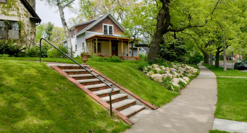 Two homes on a green hilltop in teh Malacaster-Groveland neighborhood in St. Paul