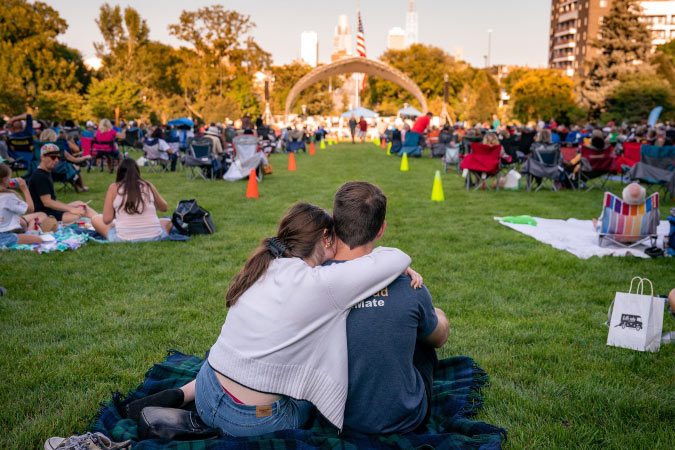 Hundreds of residents relax on a public lawn in Omaha, Nebraska, during one of the city’s summertime music festivals.