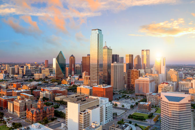 Aerial view of the Dallas, Texas, skyline during sunset. 