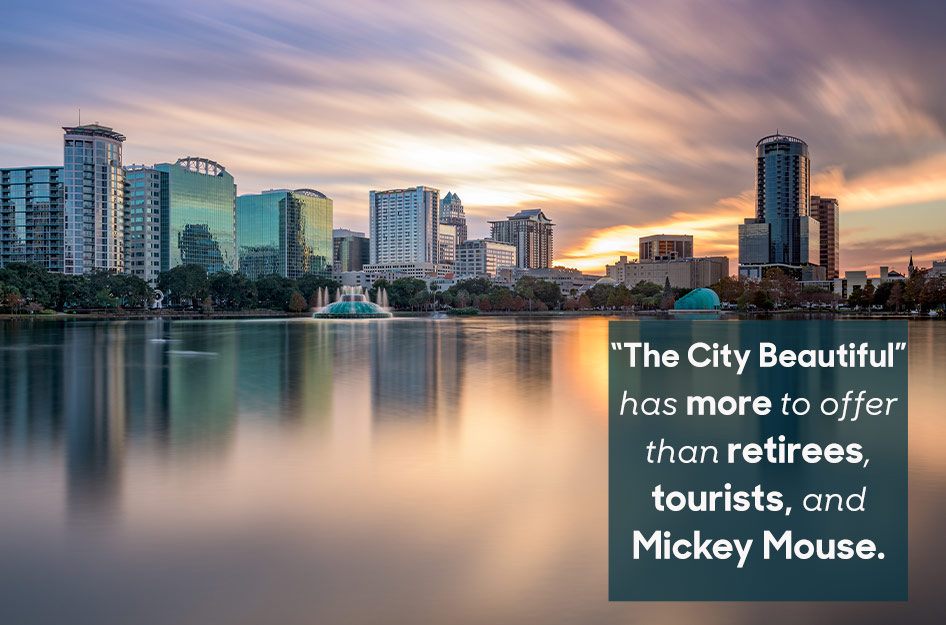 A beautiful sunset city view from across a still lake in one of the best neighborhoods in Orlando, Florida. Overlaid text reads “‘The City Beautiful’ has more to offer than retirees, tourists, and Mickey Mouse.”