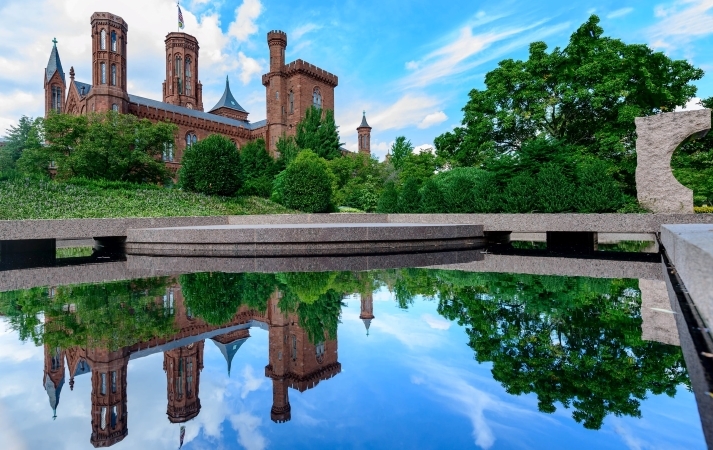 A view of The Smithsonian Institution and its reflection in an onsite water feature.
