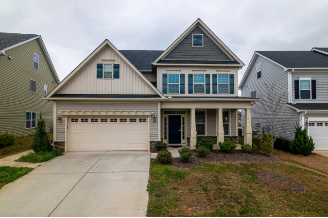 A beige home that is located in the Jacksonville neighborhood of Riverside.
