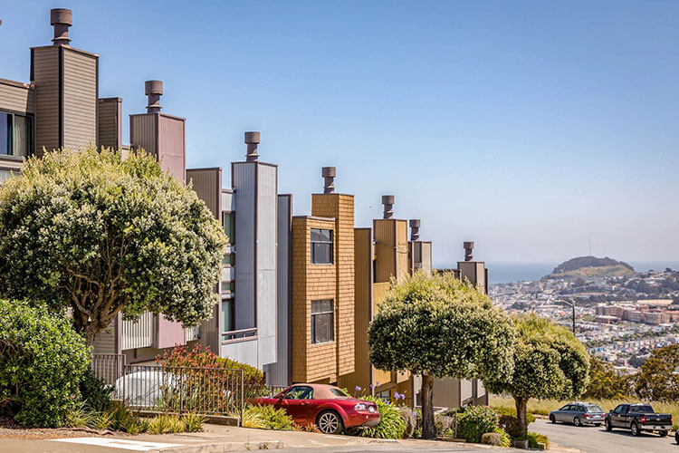 Townhomes in the Glen Park neighborhood of San Francisco. The homes all have a similar design but with unique exterior materials and colors.