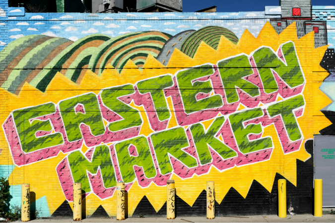 A spray painted sign that reads 