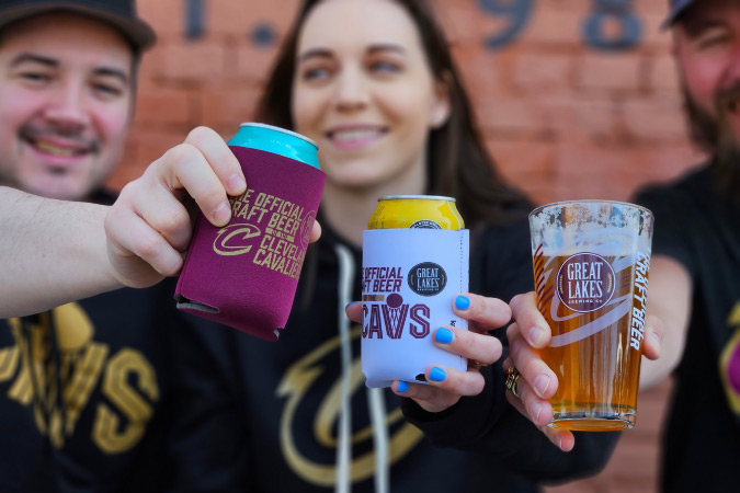 Friends cheers to the Cavaliers with their craft beers from Great Lakes Brewing Company in Cleveland, Ohio. 