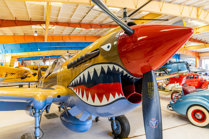 Close-up view of the nose of an ornately painted airplane at the War Eagles Air Museum in Santa Teresa, NM — one of the best El Paso suburbs.