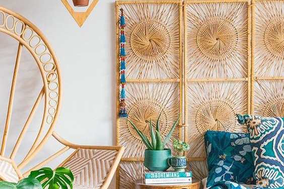 A modern headboard and nightstand with a face etched into it