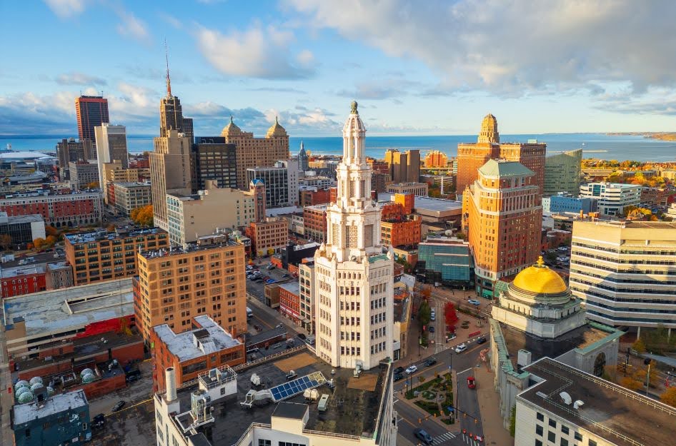 Aerial view of downtown Buffalo, New York, showcasing historic architecture and Lake Erie — one of the best places to buy a house for affordability and value.