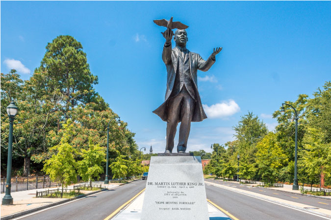A bronze statue of Dr. Martin Luther King, Jr. overlooks Liberty Plaza in Atlanta, Georgia.